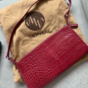 Never worn Monsac leather fuchsia clutch.